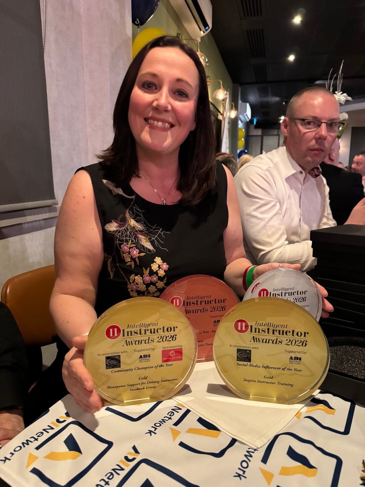Diana Todd holding the Intelligent Instructor Awards 2026 trophies